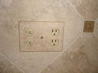 Tumbled travertine switch plate covers