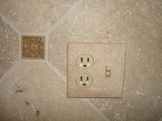 Tumbled travertine switch plate