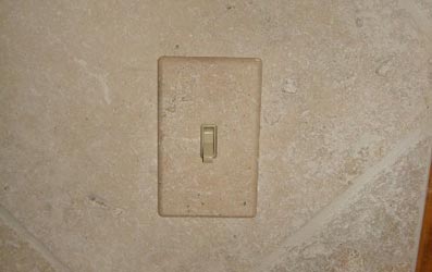 Tumbled travertine switch plate